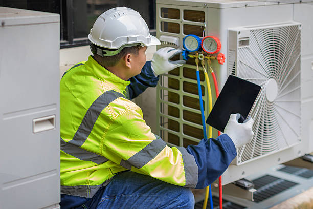 Professional Air Conditioning Repair technician working in Monticello, IA